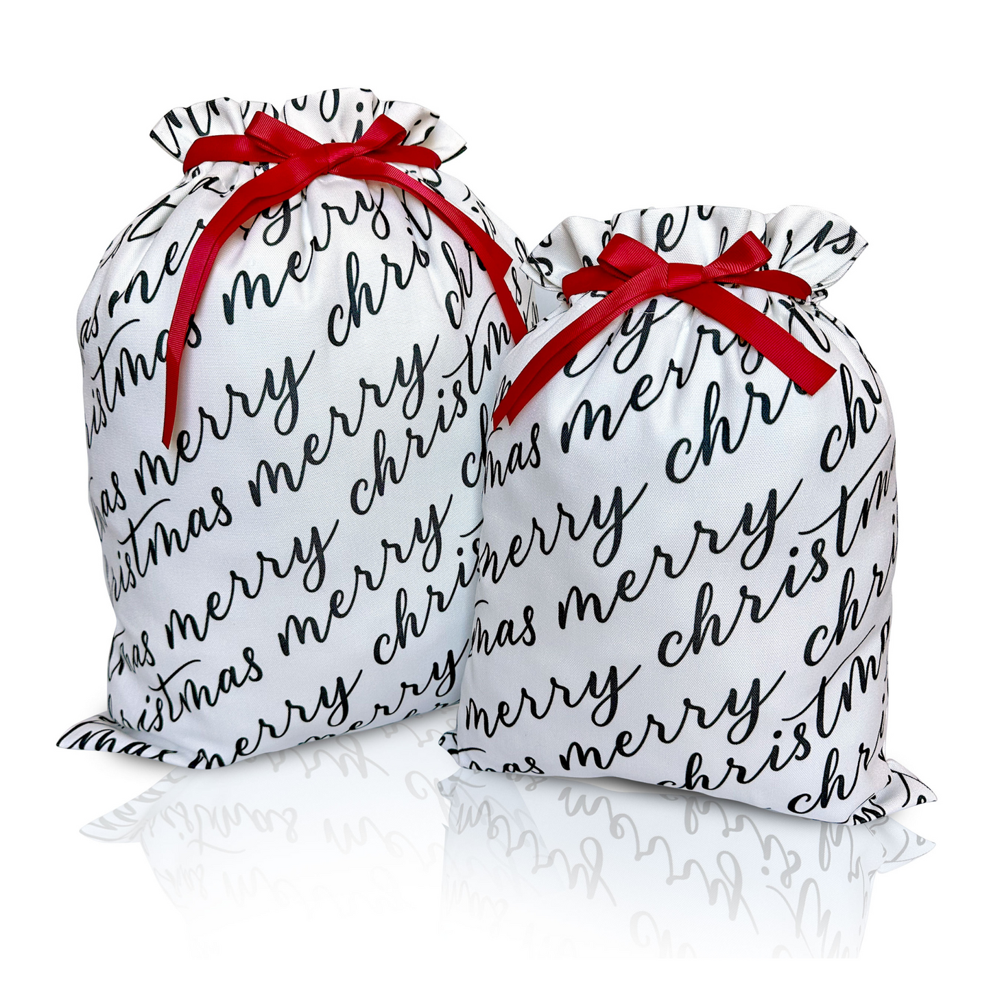 Two white fabric gift bags with 'Merry Christmas' text in black calligraphy, each adorned with a red ribbon.