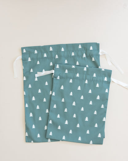 Drawstring bag with tree pattern on a green background 