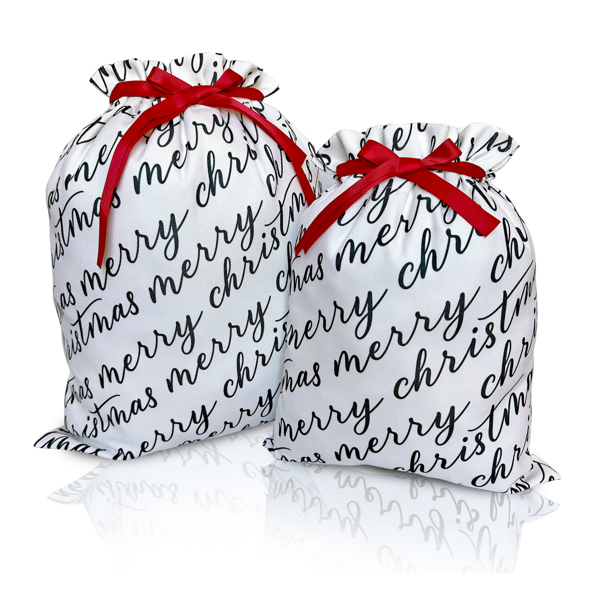 Two white fabric gift bags with 'Merry Christmas' text in black calligraphy, each adorned with a red ribbon.
