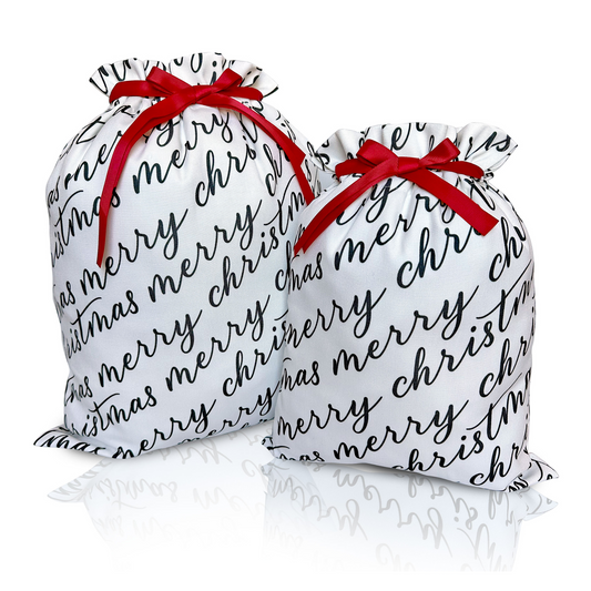 Two white fabric gift bags with 'Merry Christmas' text in black calligraphy, each adorned with a red ribbon.