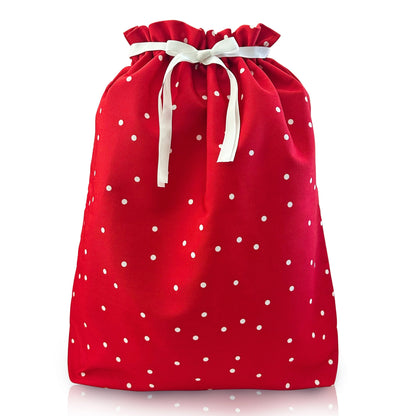 A red fabric drawstring bag with white polka dots and a white ribbon bow, shown on a clean white background.